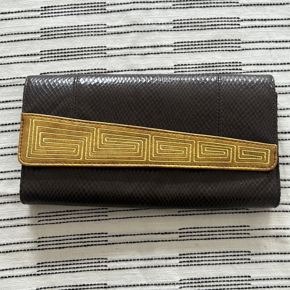 Clutch purse with gold and snakeskin details